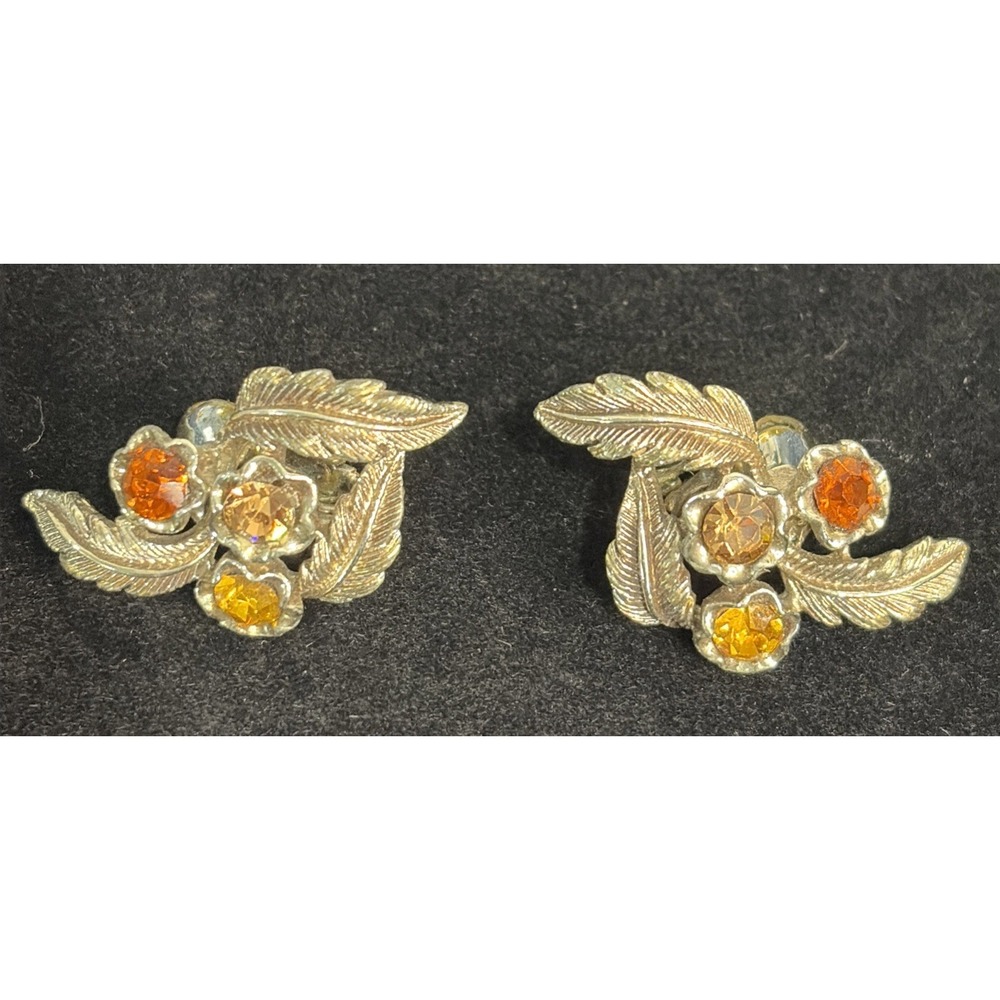 Vintage Coro Pegasus Clip On Earrings With Rhinestones On Gold Tone Circa 1960's